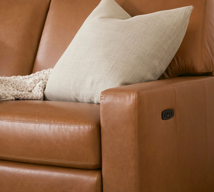 Close-up of armrest and light fabric pillow