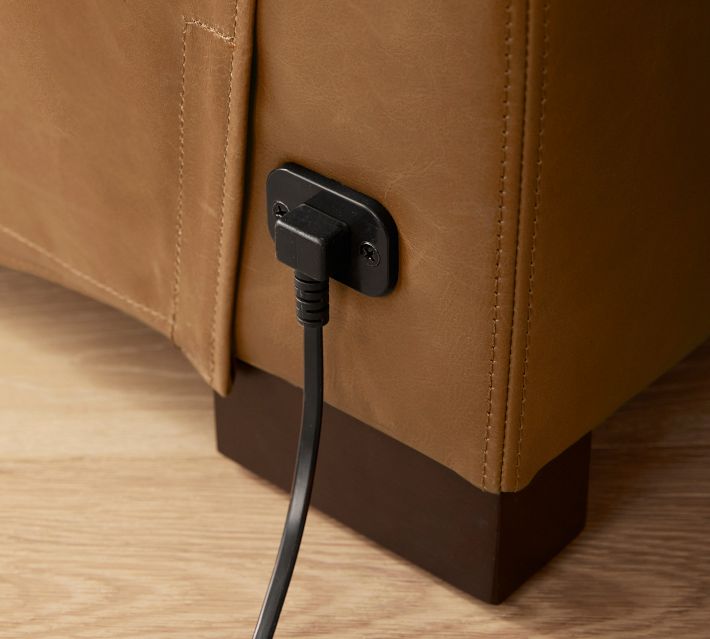 Electrical power plug connected to sofa outlet