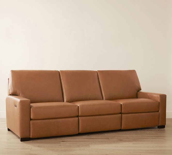 Three-seat leather sofa with one armrest on left, side view