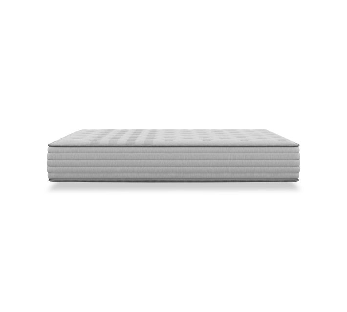 Side view of a low-profile light gray mattress with stitched layers, isolated on white background.