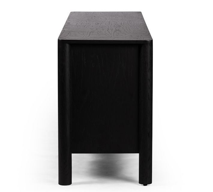 Side view of a single black wood cabinet leg and top surface.
