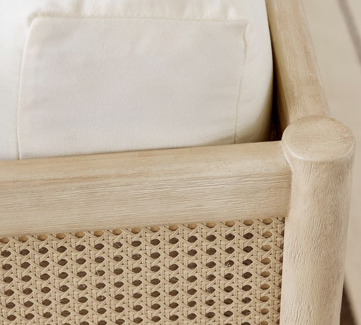 Close-up of the sofa leg and woven panel on the base