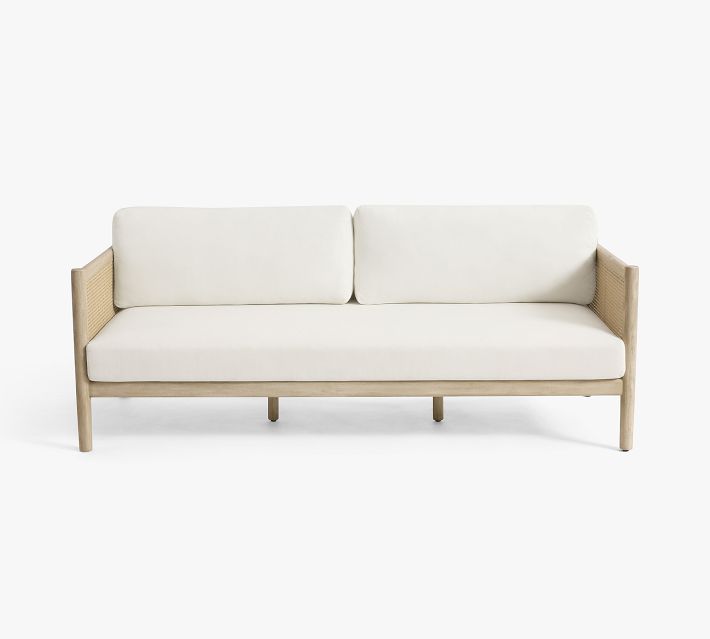 Whole white cushioned sofa with light wood frame