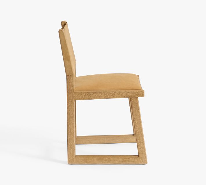 Profile view of the chair showing side stance and leg structure