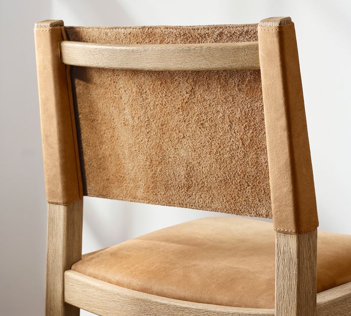 Back of the same chair showing cork panel insert between wooden frame