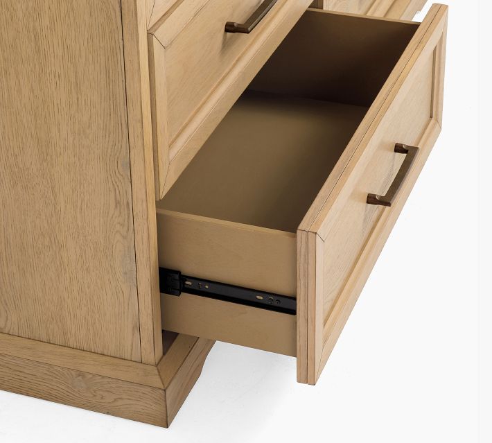 Open drawer with sliding metal rails and empty interior.