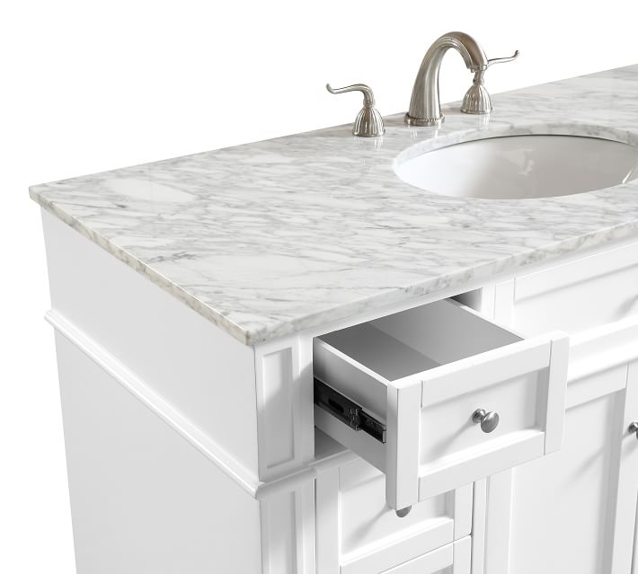Close-up of countertop edge and drawer front, showing cabinetry details.