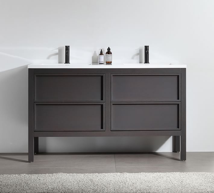 Wide view of double sink vanity with white countertop and dark wood base.