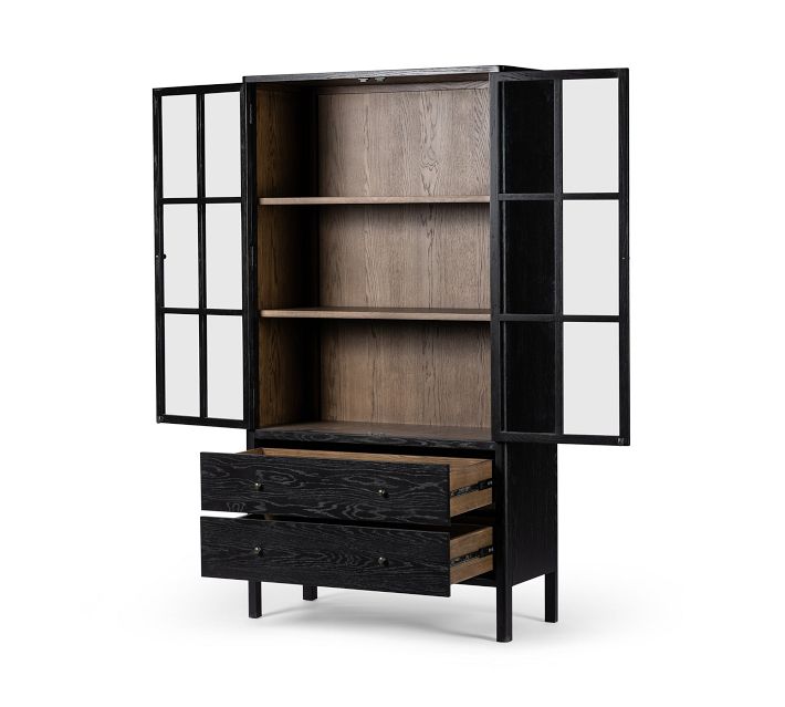 Medium width black cabinet with two glass doors open, showing shelves and drawers.