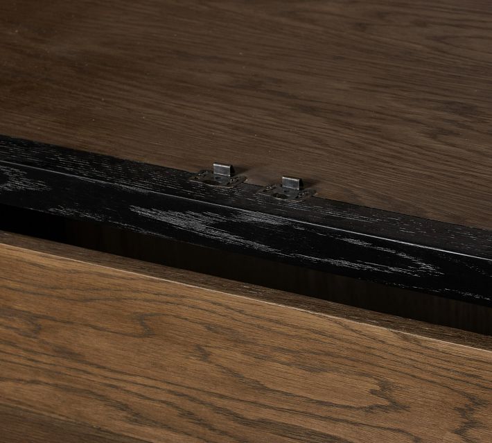 Close-up of drawer interior and metal hardware under drawer.
