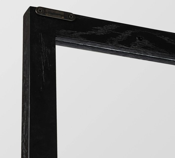 Hinged joint on top edge of cabinet with black finish.