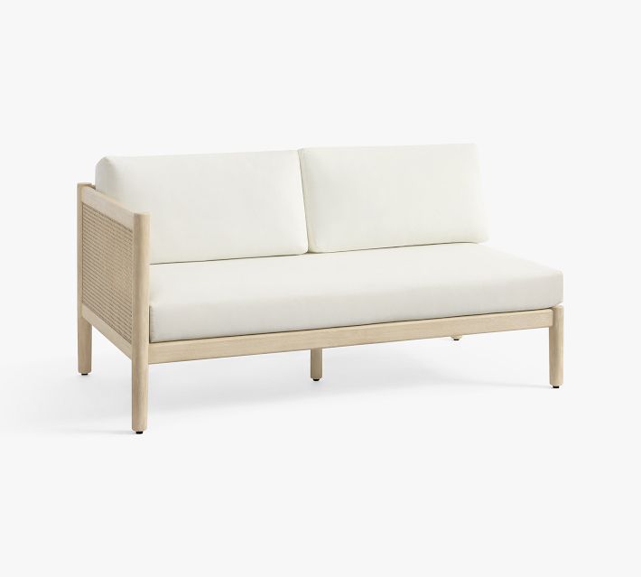 Two-seat sofa with cane panel back and white cushions