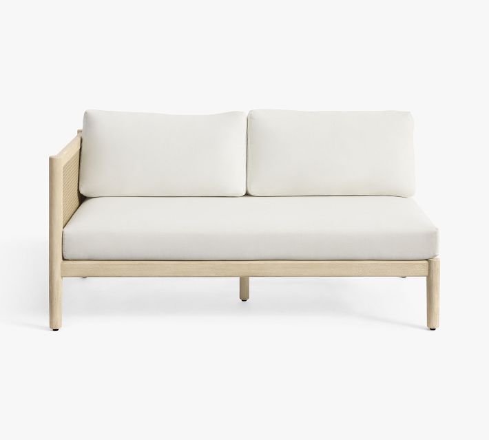 Front view of two-seat sofa with white cushions and cane panel back