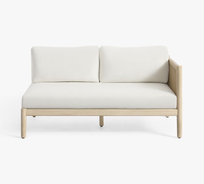 Two-seater white cushioned sofa with wooden frame and cane panel on sides