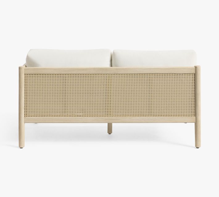 Rear view of two-seater sofa with cane panel back