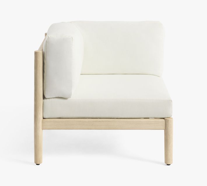 Side view of white cushioned sofa showing back and cushion