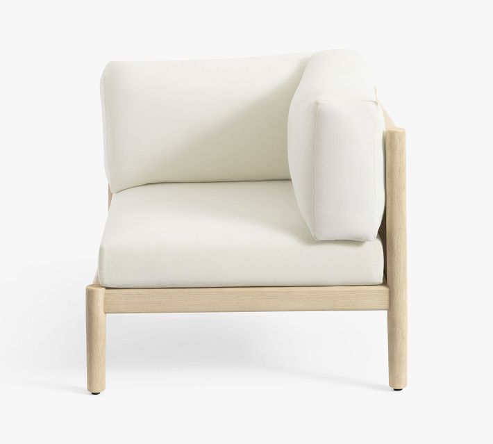 Front view of white cushioned armchair with wooden frame