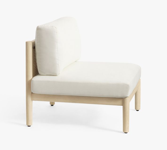 Side view of white cushioned lounge chair with wooden frame