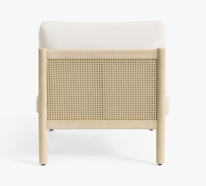 Back view of lounge chair showing cane woven panel and wooden frame