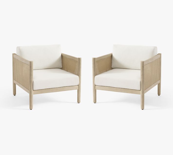 Pair of matching outdoor lounge chairs facing each other on white background.