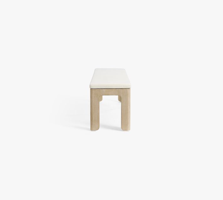 Front view of a wooden bench with white cushion, isolated on white background