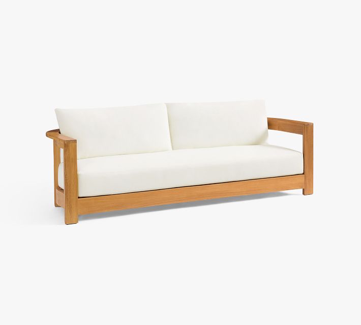 White cushioned sofa with wooden frame, front view