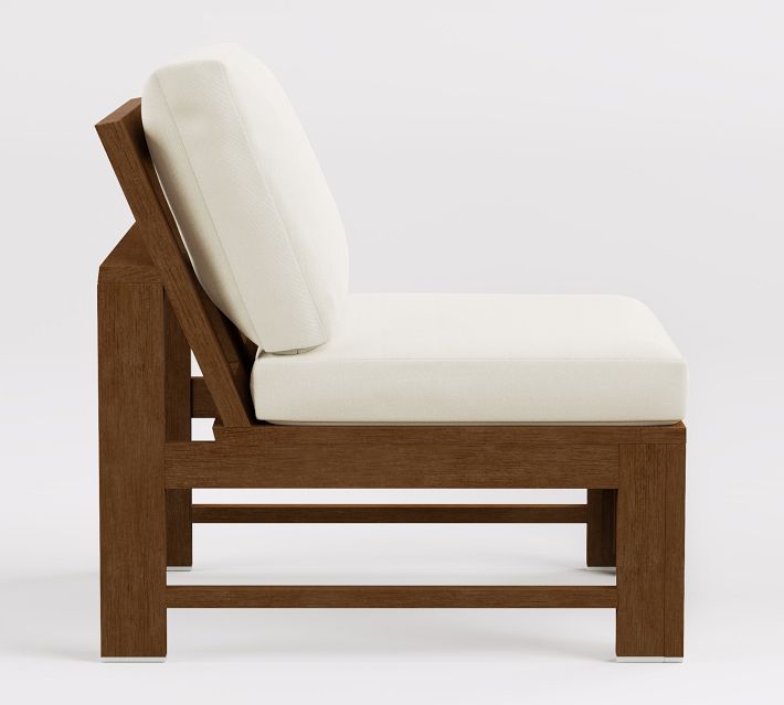 Back view of wooden lounge chair with cream cushions