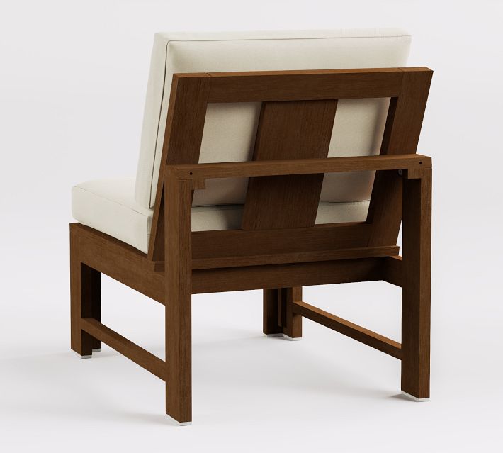 Back view of wooden armchair with cream cushion
