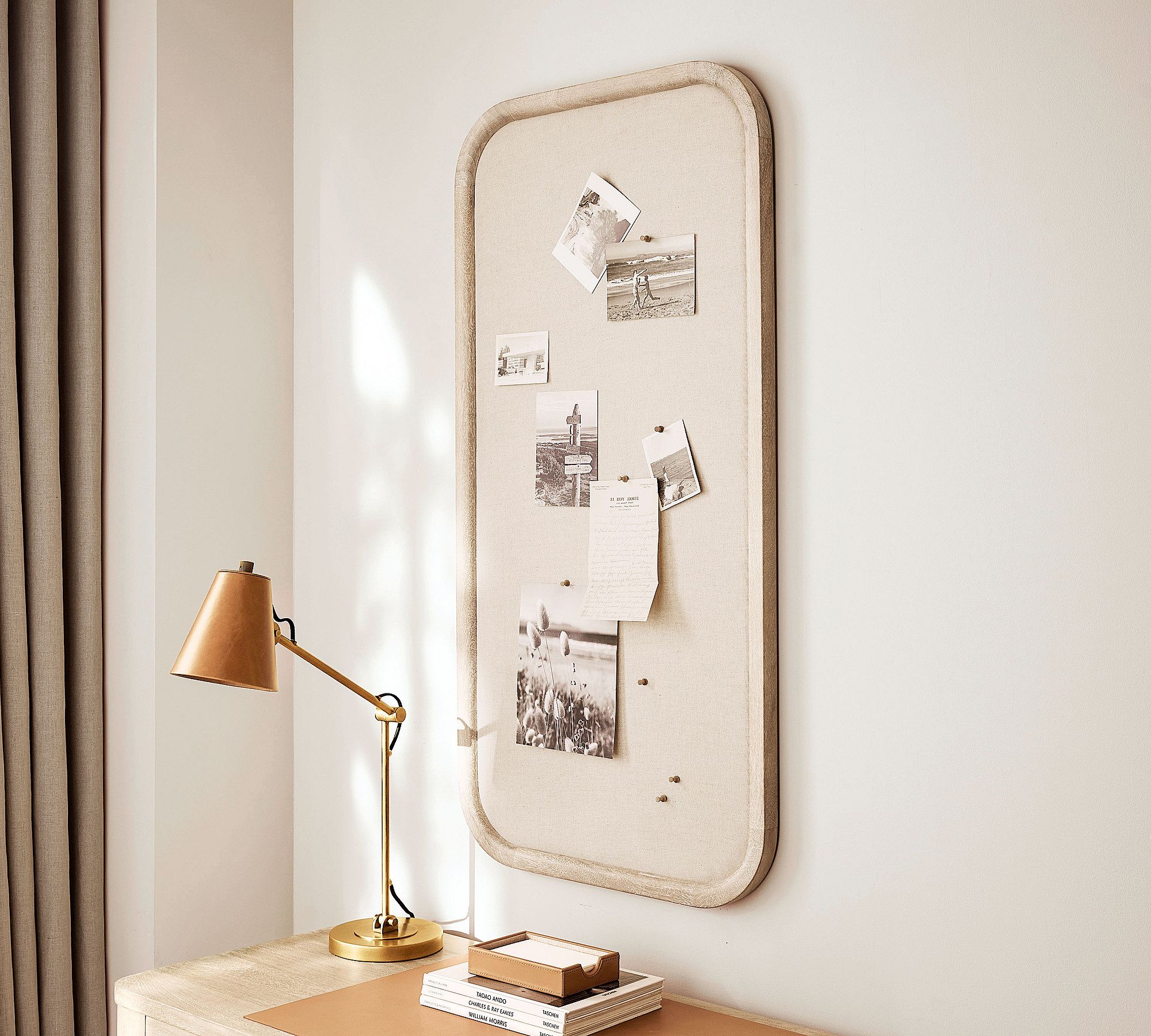 Cork vision board with pinned notes and photos