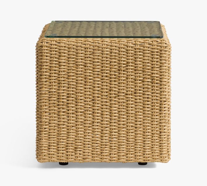 Rattan cube side table with glass top, front view against white background