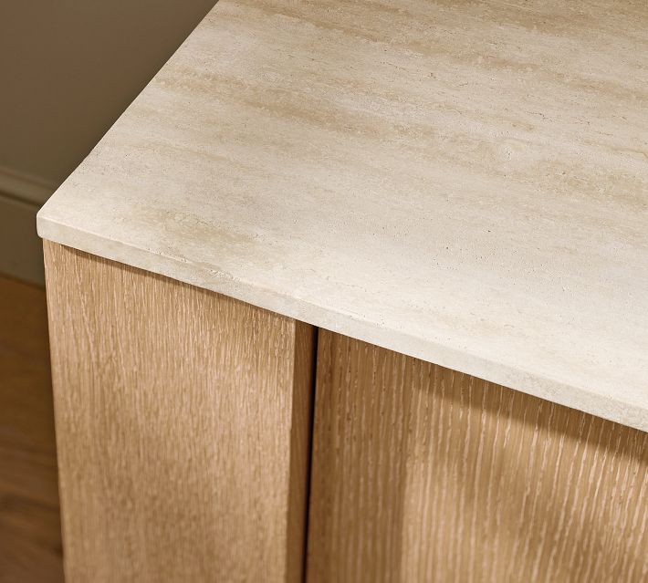 Top edge and corner of the cabinet with light stone-like countertop