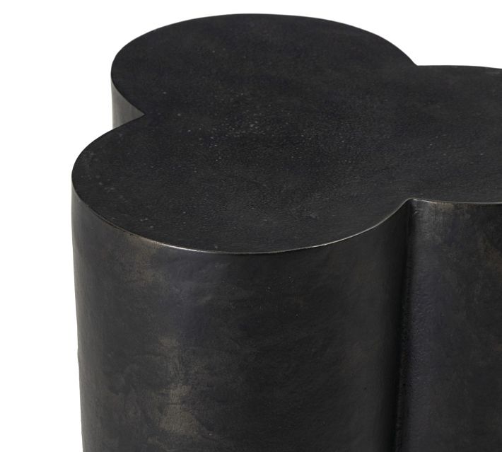 Side view of heart-shaped clover top on metal cylinder base