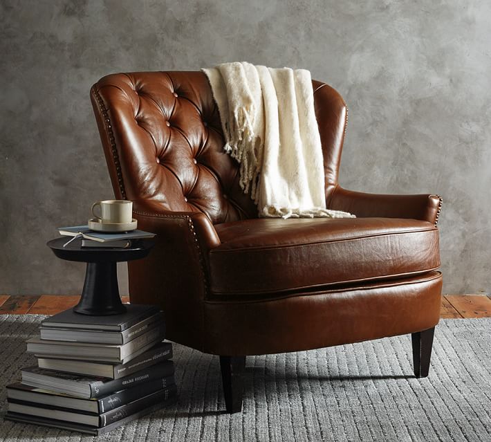 tufted leather chair and a half