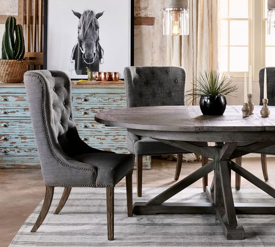 Dining Room Wood Table Black Chairs  . A Cottage Style Dining Room With A Rustic Table Surrounded By Wooden Roundback Chairs Over Herringbone Wood Flooring.