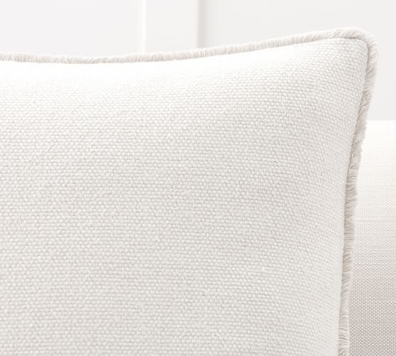 white fringe cushion