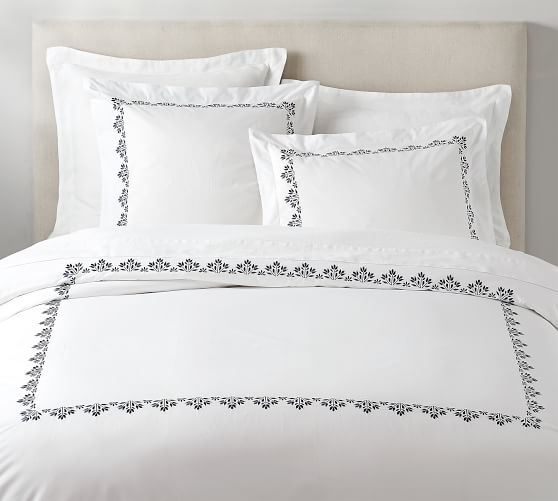 white duvet with blue embroidery