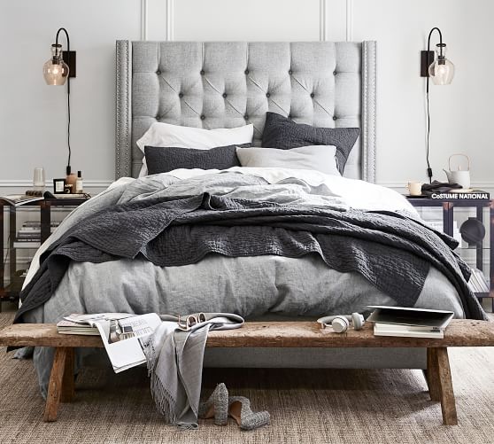 grey high back upholstered bed