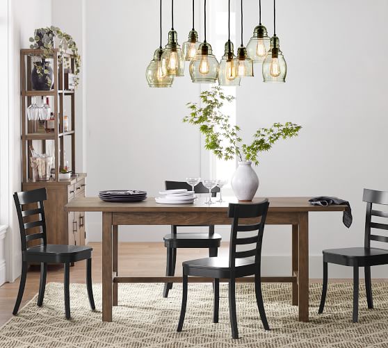 multiple pendant lights over dining table