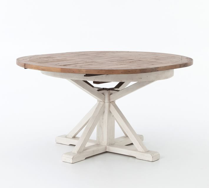Small circular-top pedestal table in sheet metal with ho…