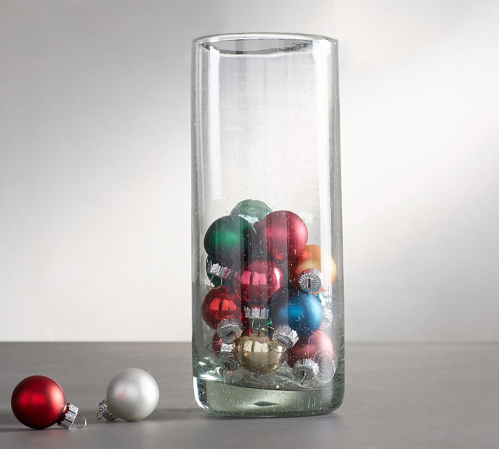 Glass vase filled with artificial snow and ornaments and decorative vase  fillers from Pottery b…