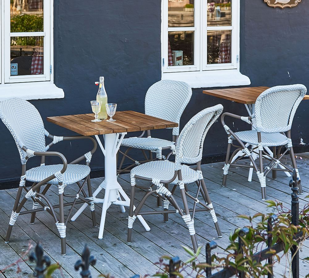 Isabell Rattan Outdoor Dining Armchair | Pottery Barn