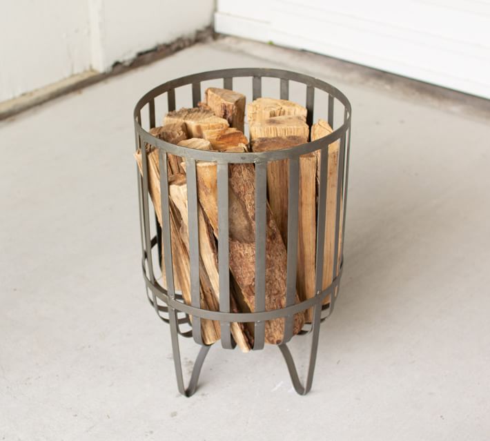 Metal log outlet baskets for fireplaces