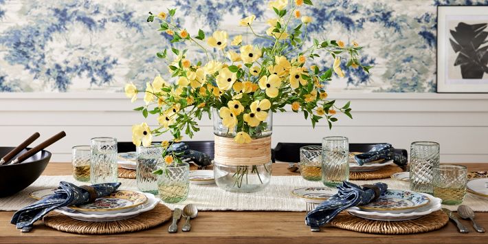 Glass salad bowl with woven rattan holder