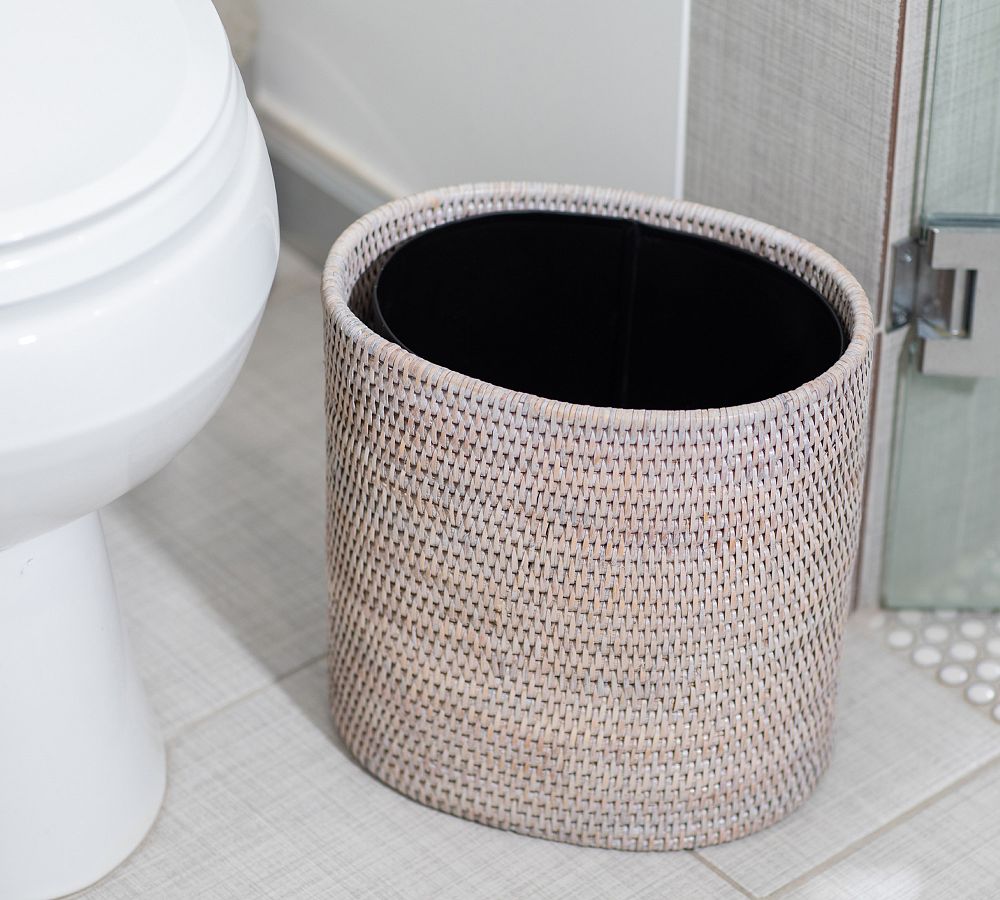 Tava Handwoven Rattan Oval Wastebasket with Metal Liner | Pottery Barn