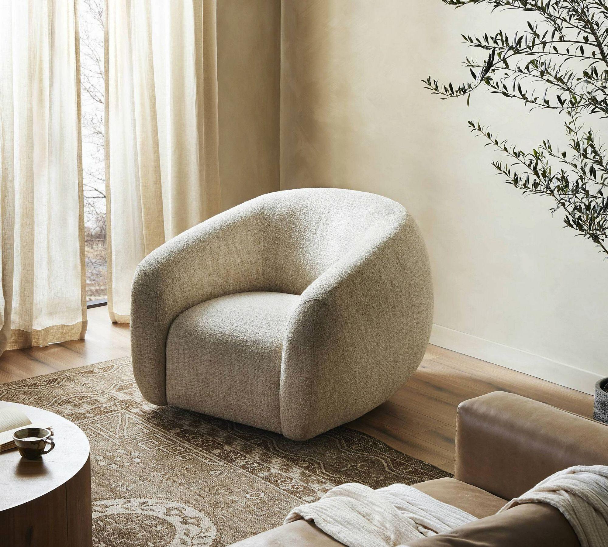 Carlin Upholstered Swivel Armchair