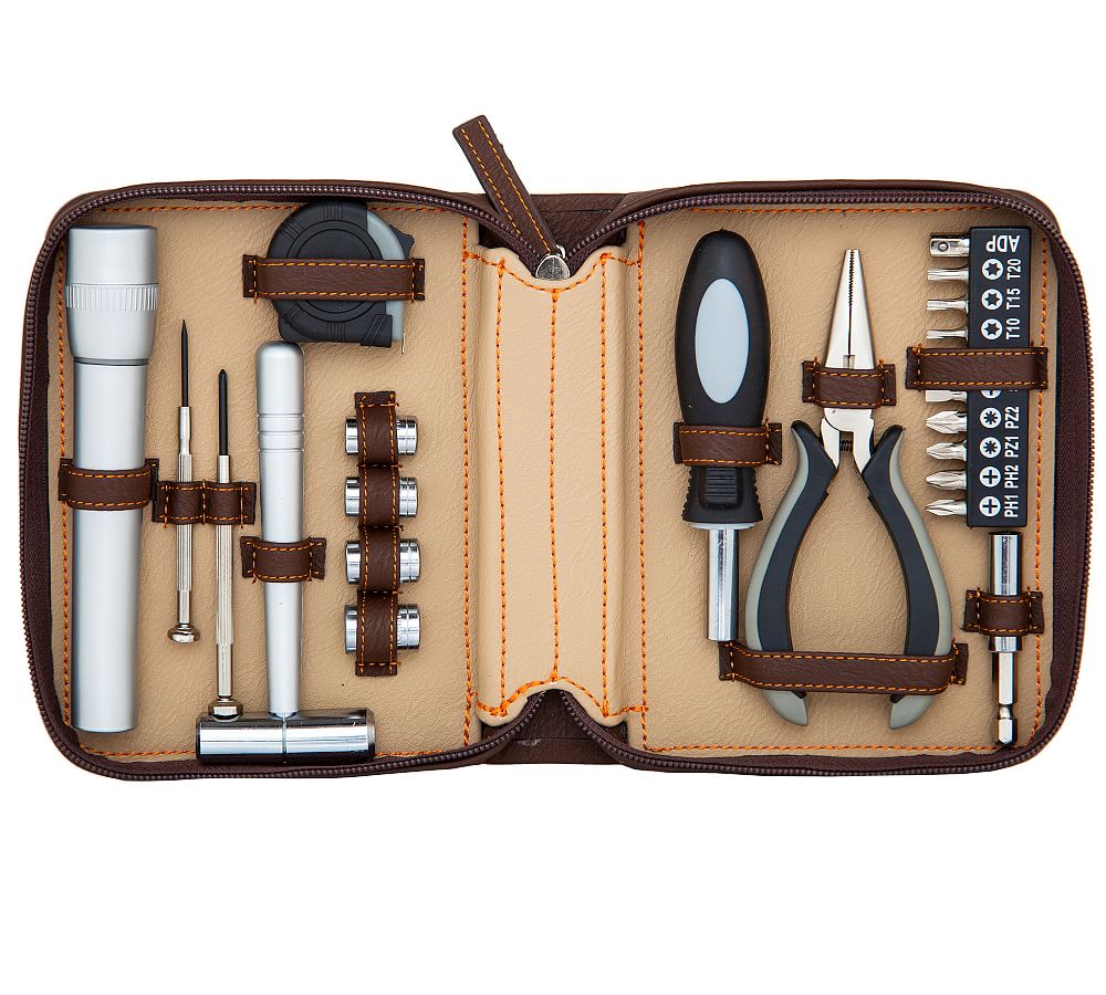 An open brown case with a variety of black and white tools inside