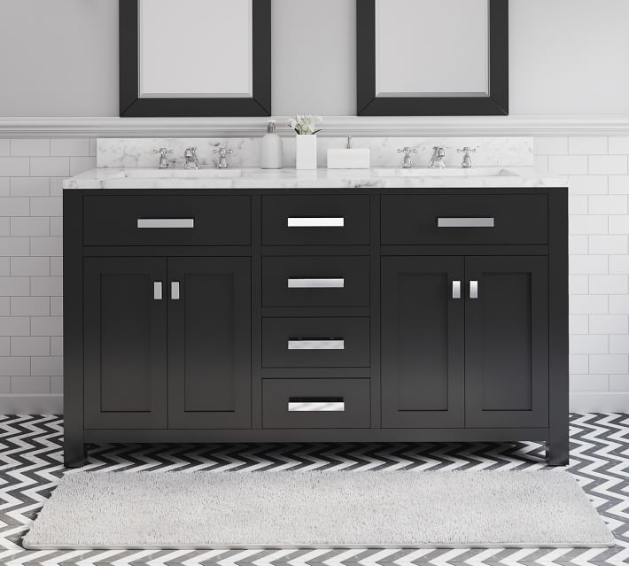 Dark gray bathroom vanity with marble top, multiple drawers, and white tile backsplash.