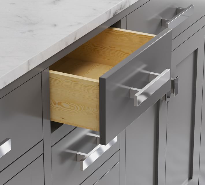 Open drawer showing wooden interior in a gray bathroom vanity.
