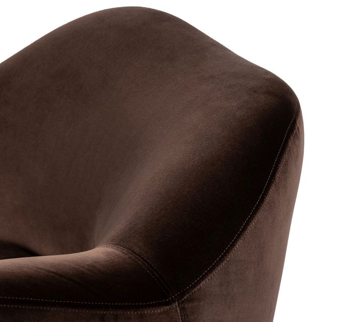 Close-up of brown velvet upholstery with stitching