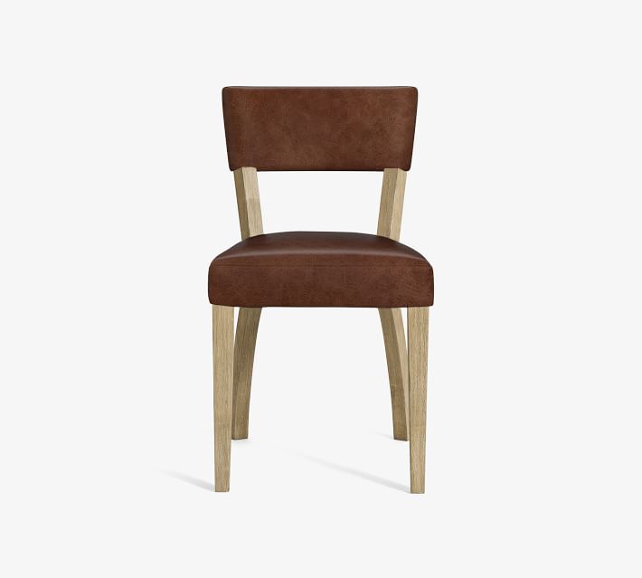 Brown leather upholstered chair with light wooden legs